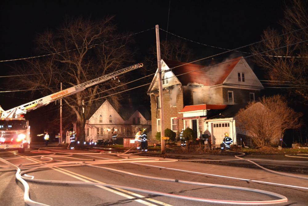 Firefighters from five departments battle house fire in Portland